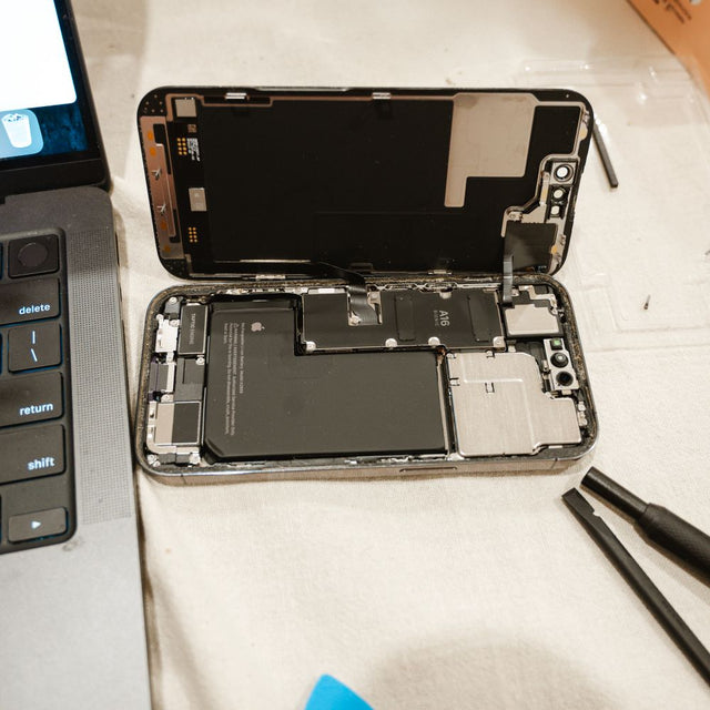 iPhone battery replacement with repair tools at SmartGear NZ