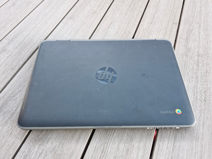 HP x360 G2 EE 11 inch Chromebook on a wooden surface