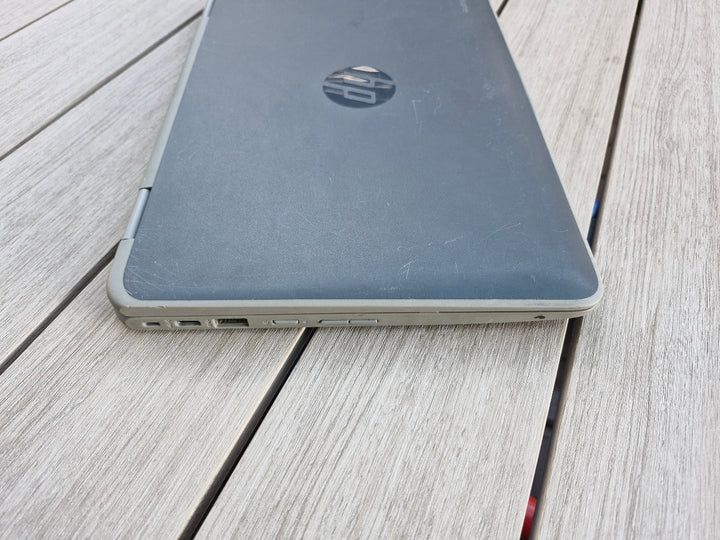 HP x360 G2 EE 11 inch Chromebook on a wooden surface