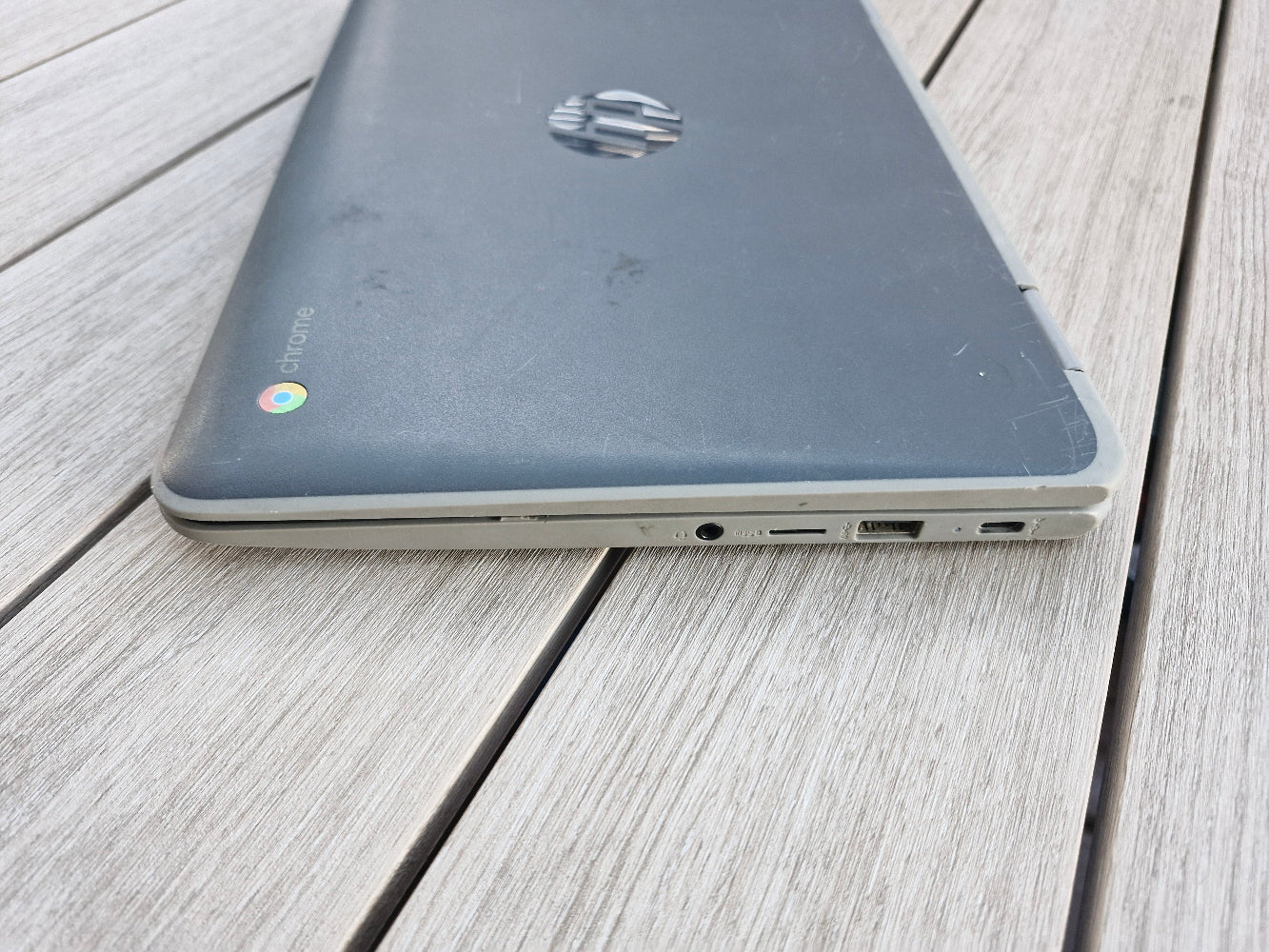 HP x360 G2 EE 11 inch Chromebookon a wooden surface