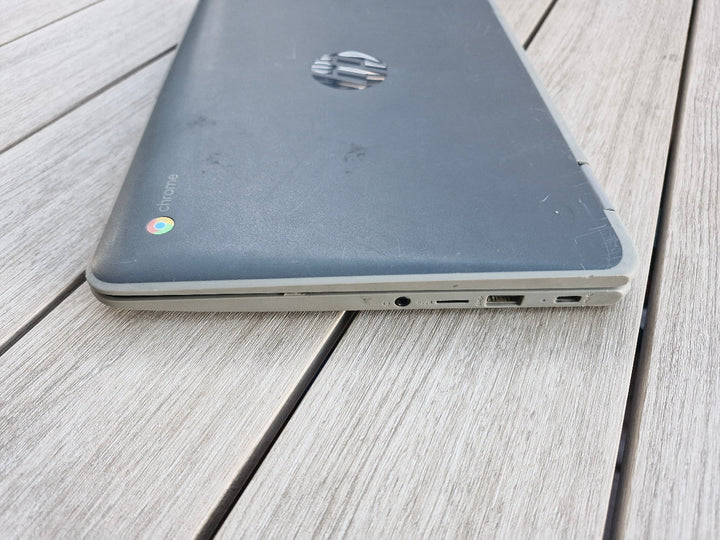 HP x360 G2 EE 11 inch Chromebookon a wooden surface