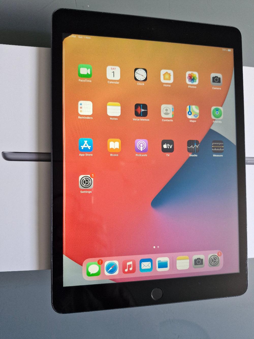 Apple iPad 7 32GB Wifi Space Grey - New Battery (Imperfect) Tablet with app icons displayed on a white surface